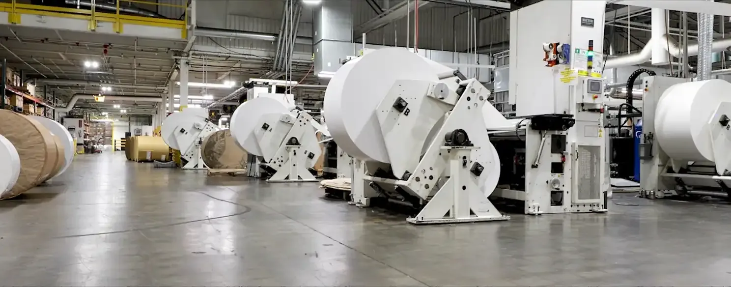 a montage of labels being printed and packaged in a factory