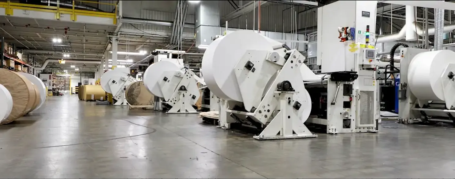 a montage of labels being printed and packaged in a factory